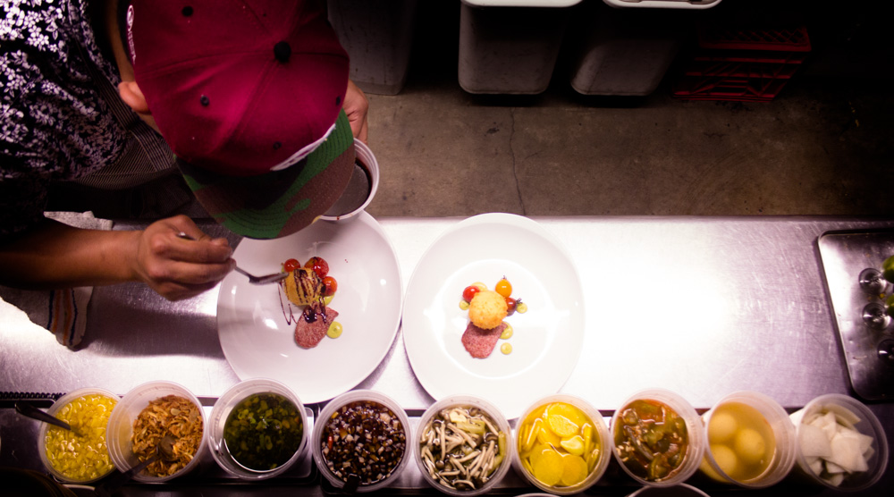 Chef Shawn Naputi plating the house made SPAM with deep fried egg