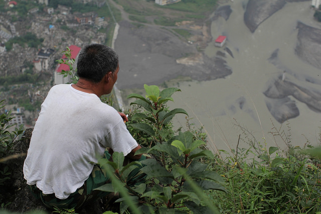 Li Mingshan, Brother Peng's father-in-law, looking down the old city on the mountain top. Photo credit: Shaoguang Sun.
